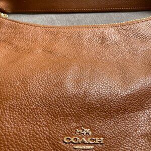 COACH authentic East West Celeste Hobo shoulder bag in tan / saddle brown.
